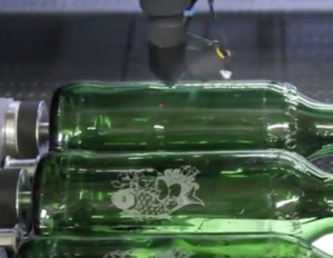 Laser engraving machine on bottle
